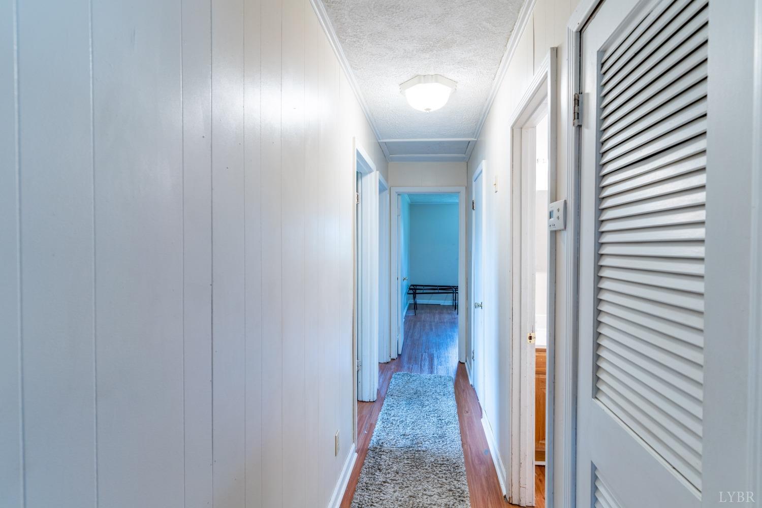 1040 Brookhill Road Forest, VA 24551 - Photo 8 of 27 a view of a hallway with a white walls and a door
