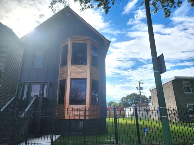 a view of a porch with a floor to ceiling window