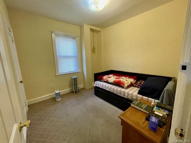 50-44 39th Street Queens, NY 11104 - Photo 3 of 15 a living room with furniture and a window