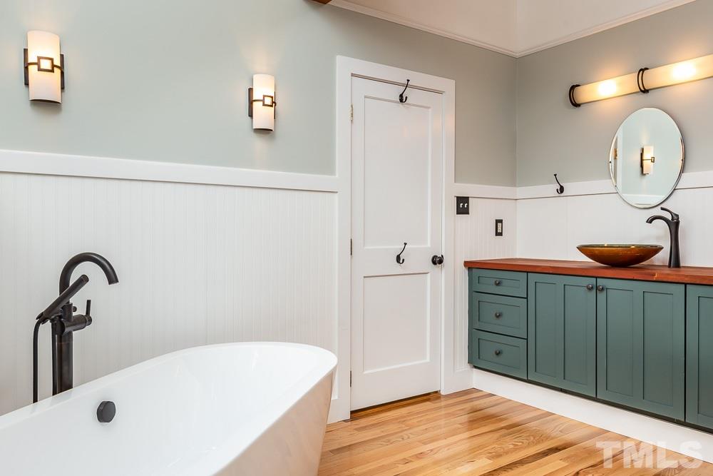 816 Runnymede Road Raleigh, NC 27607 - Photo 22 of 30 a bathroom with a tub and sink
