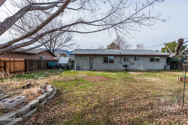 a front view of house with a garden