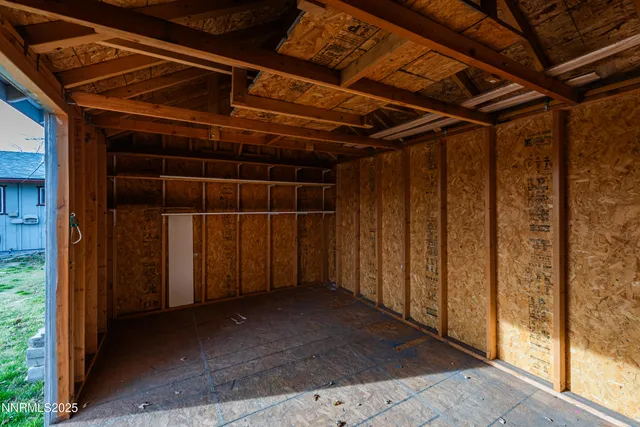 a view of a room with wooden walls