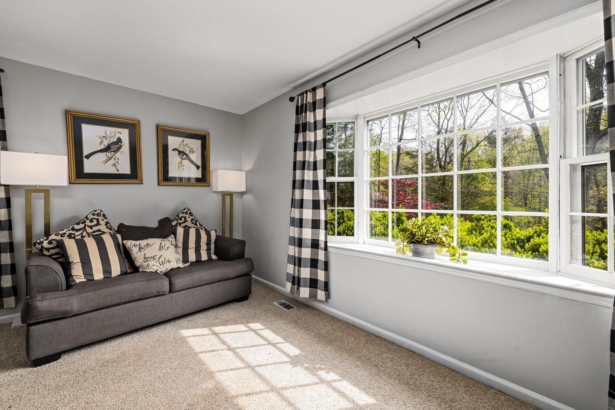 5901 Scalybark Road Durham, NC 27712 - Photo 12 of 49 a living room with furniture and a large window