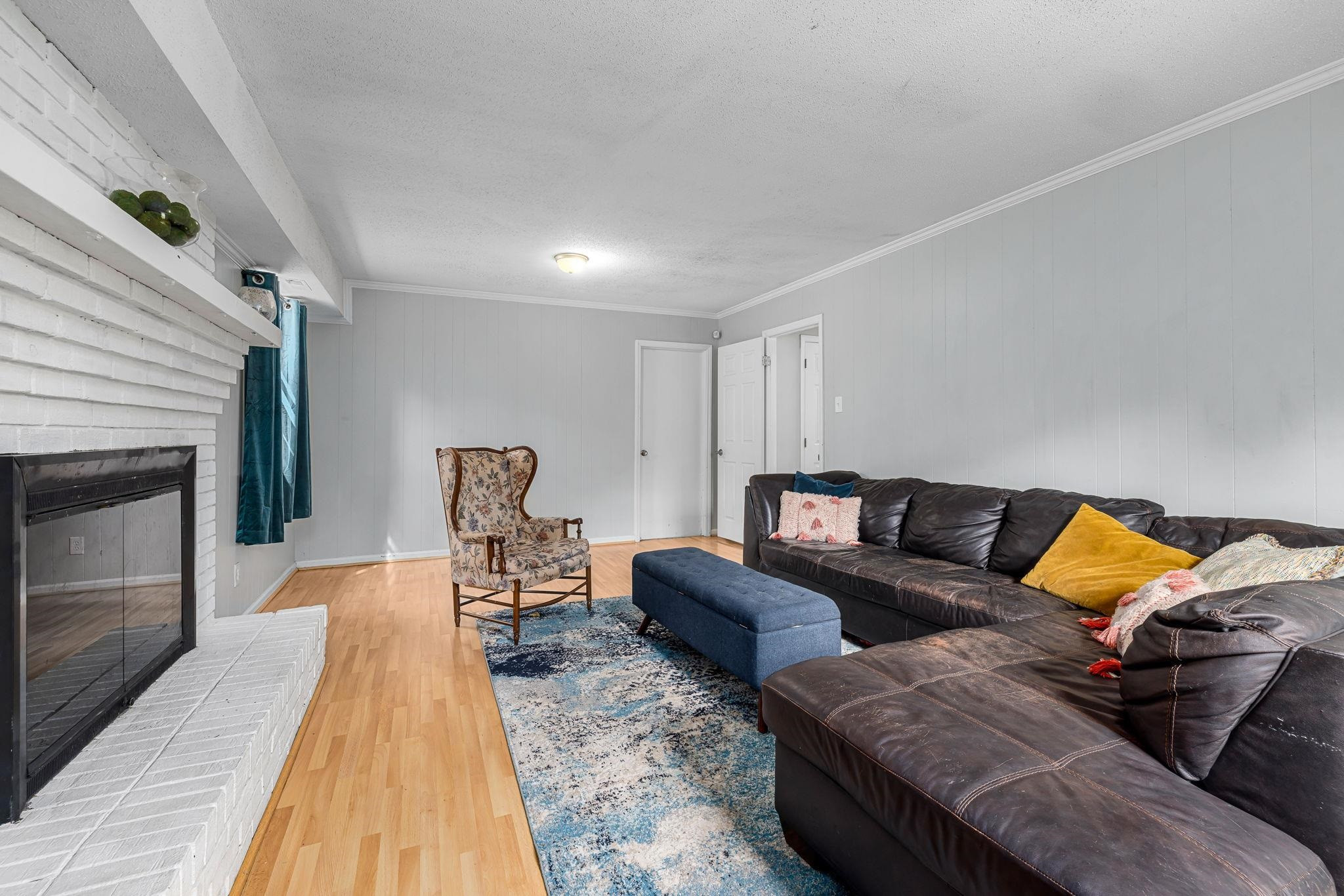5901 Scalybark Road Durham, NC 27712 - Photo 25 of 49 a living room with furniture and a fireplace