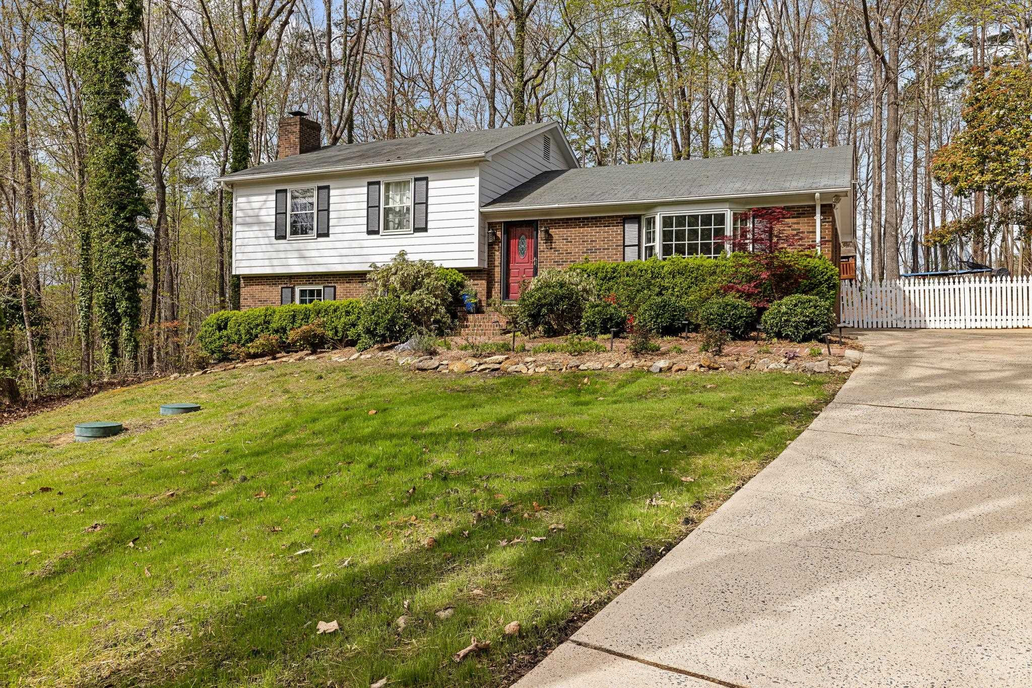 5901 Scalybark Road Durham, NC 27712 - Photo 3 of 49 a front view of a house with a yard