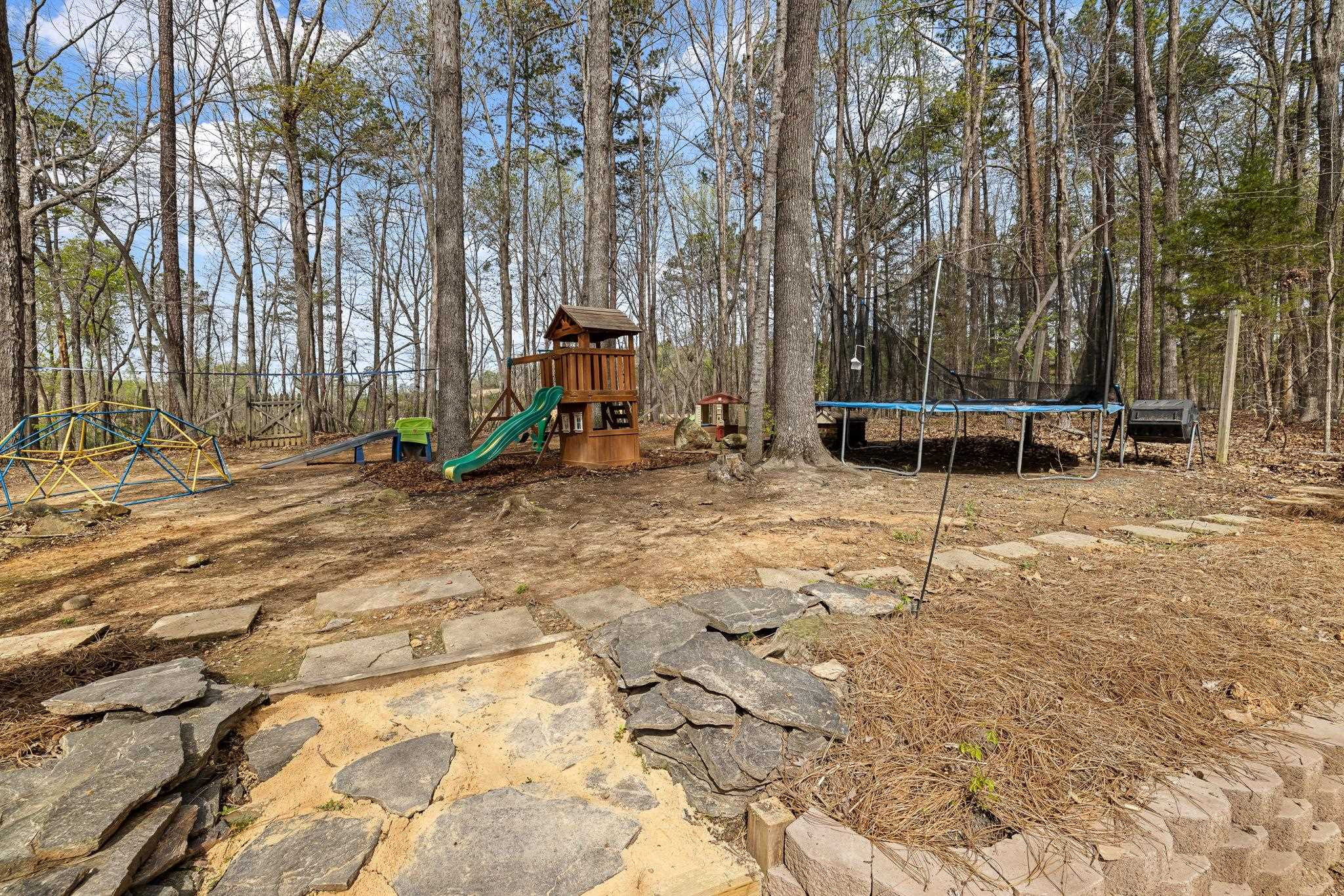 5901 Scalybark Road Durham, NC 27712 - Photo 44 of 49 a view of a park with swings and slides