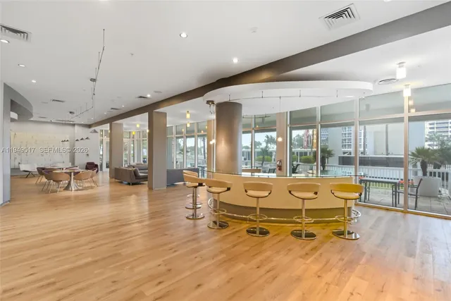 a room with lots of furniture and a chandelier