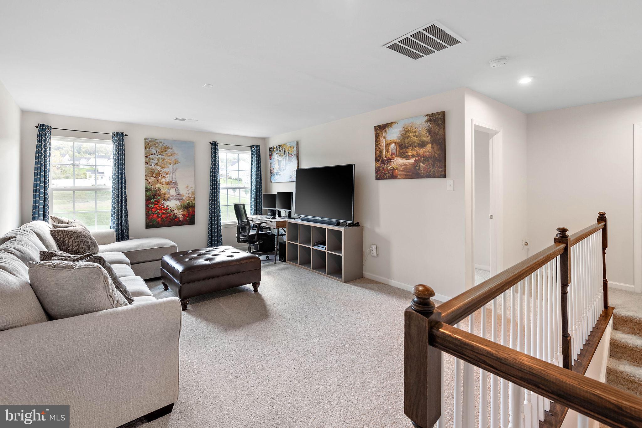 102 Pixie Moss Road Pottstown, PA 19464 - Photo 20 of 45 a living room with furniture and a flat screen tv