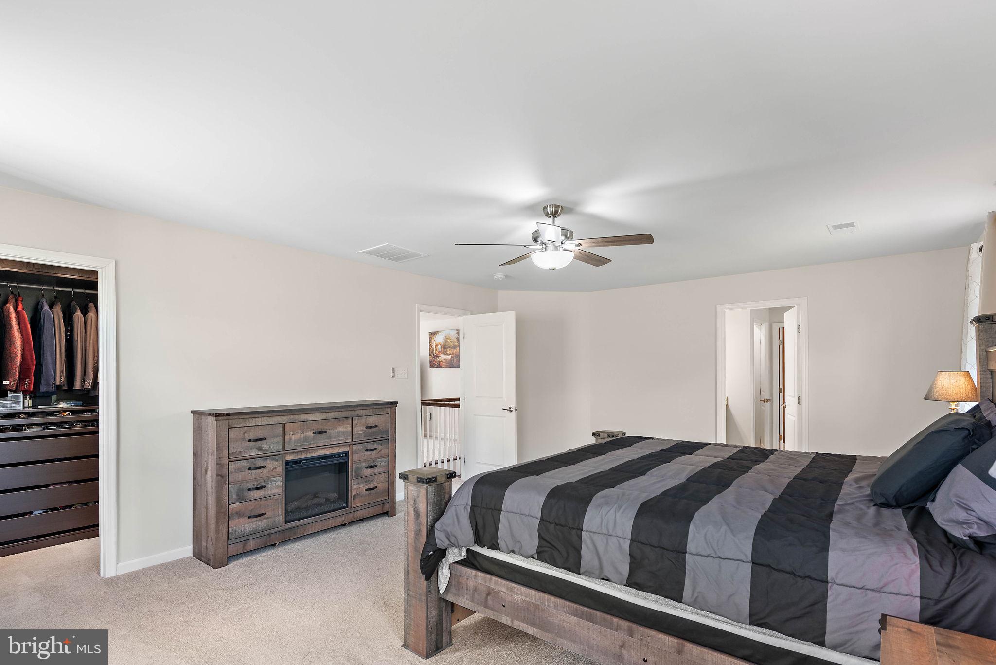 102 Pixie Moss Road Pottstown, PA 19464 - Photo 22 of 45 a bedroom with a bed and a fireplace