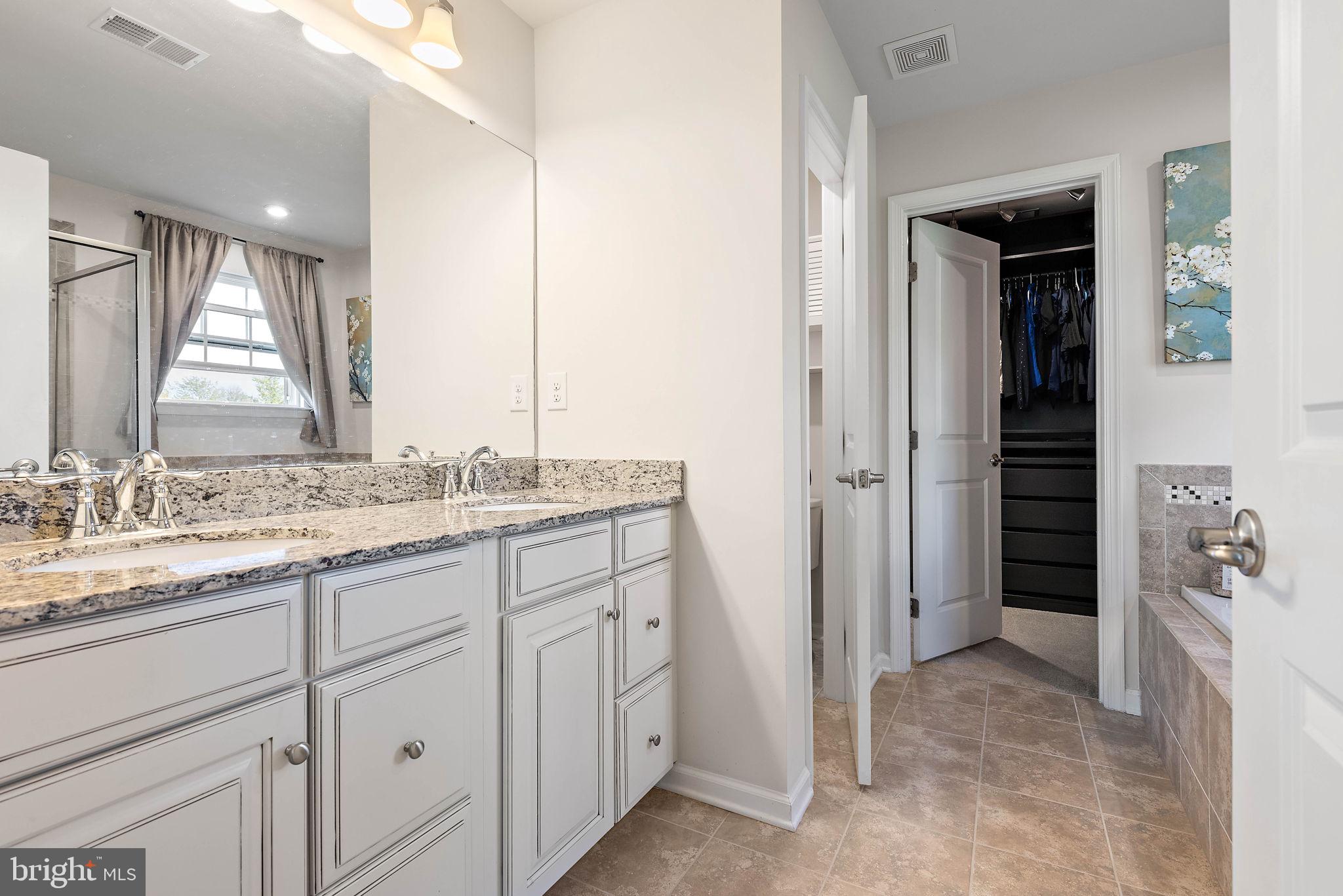 102 Pixie Moss Road Pottstown, PA 19464 - Photo 23 of 45 a bathroom with a granite countertop sink and a mirror
