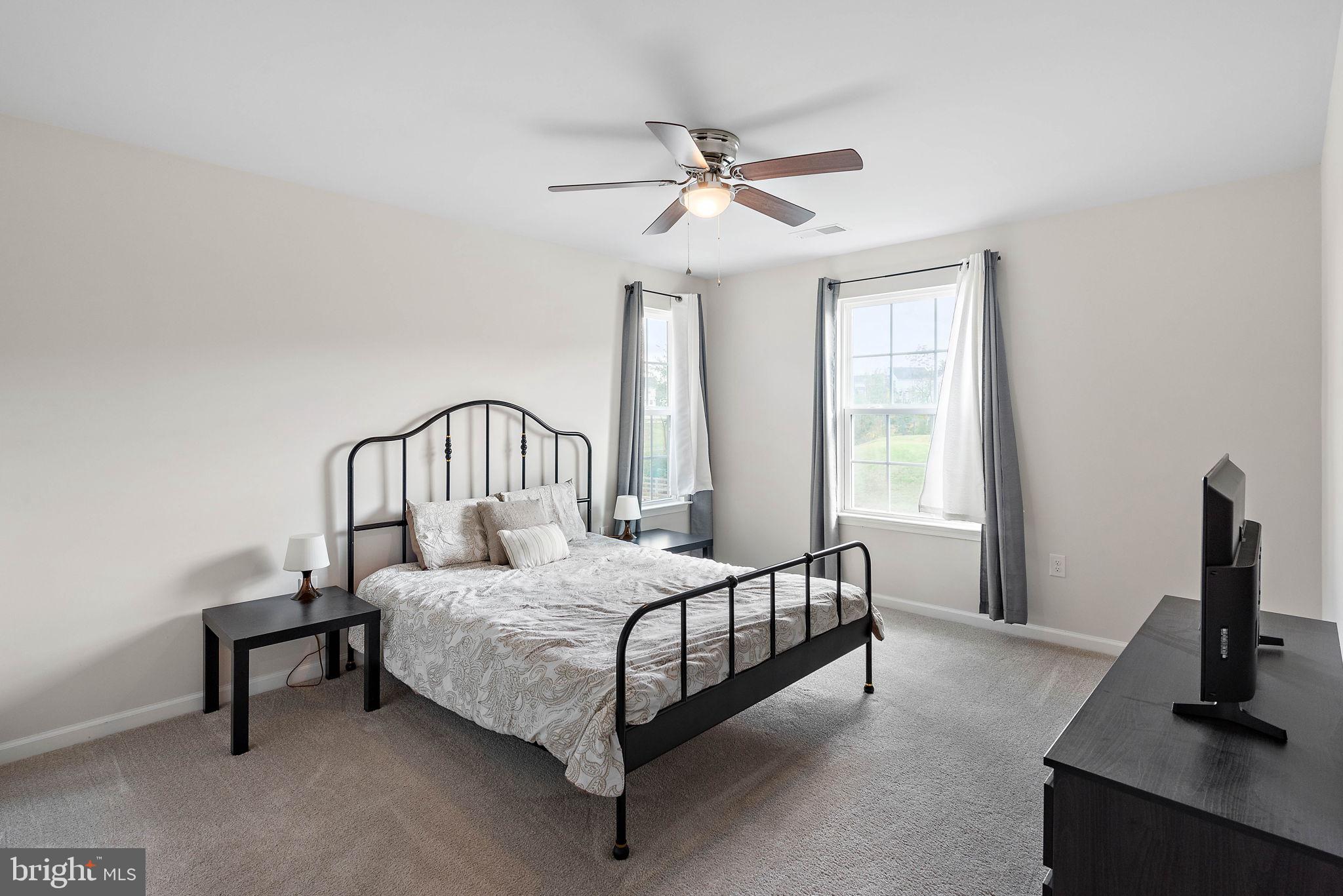 102 Pixie Moss Road Pottstown, PA 19464 - Photo 26 of 45 a bedroom with a bed chair and a window