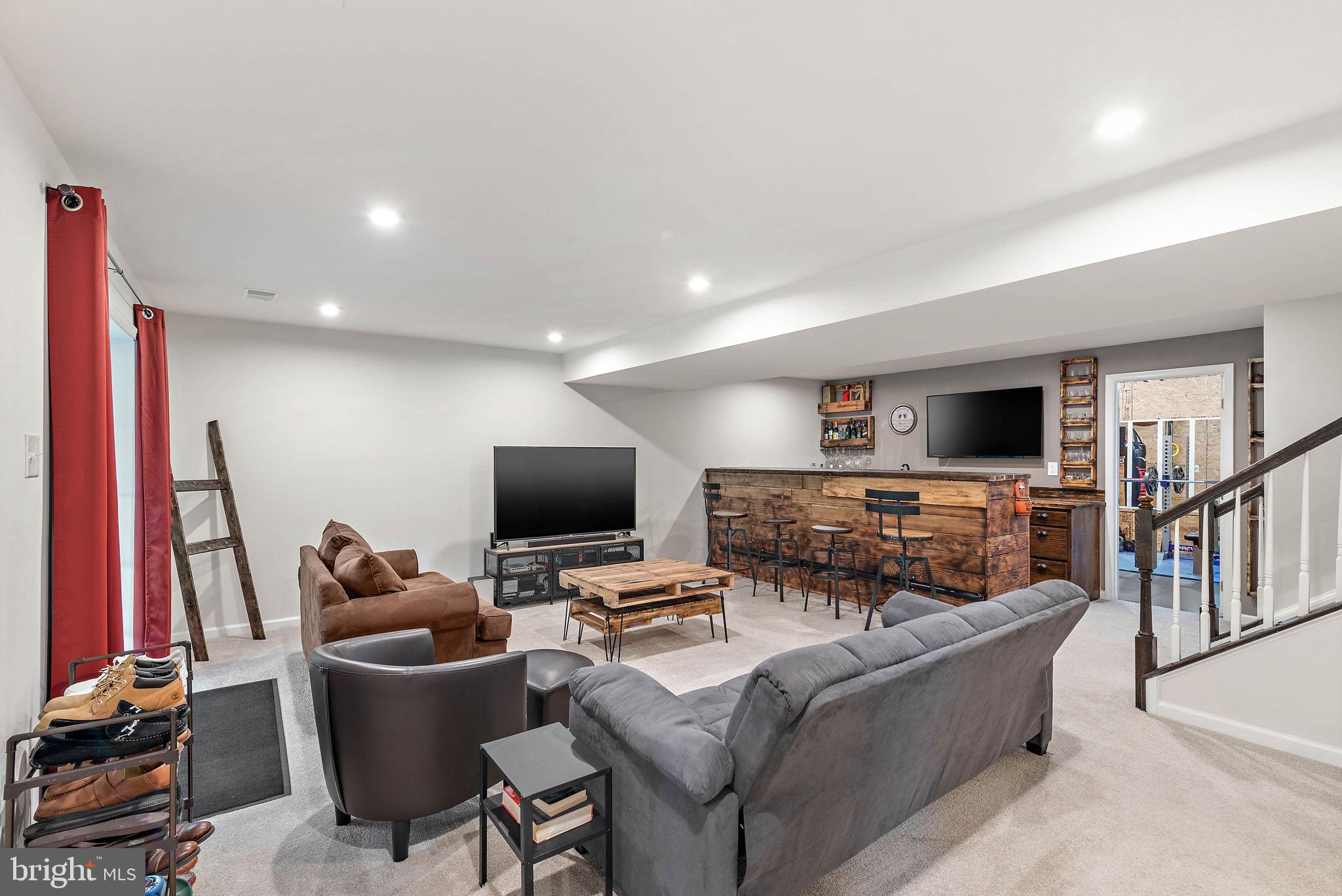 102 Pixie Moss Road Pottstown, PA 19464 - Photo 27 of 45 a living room with furniture and a flat screen tv
