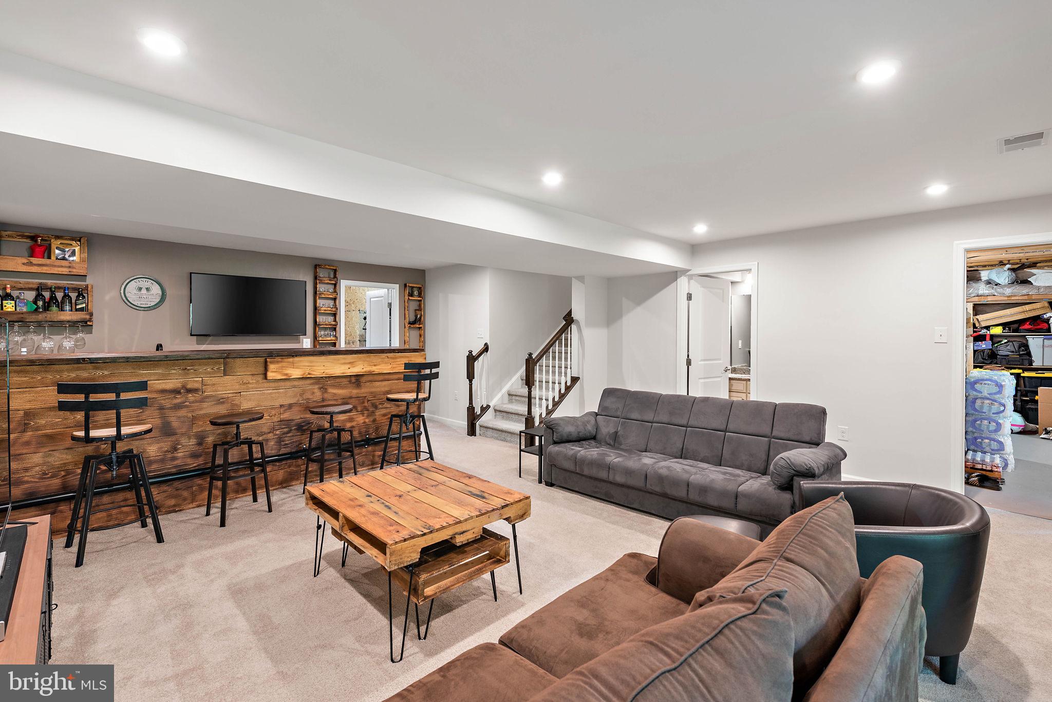 102 Pixie Moss Road Pottstown, PA 19464 - Photo 28 of 45 a living room with furniture and a flat screen tv