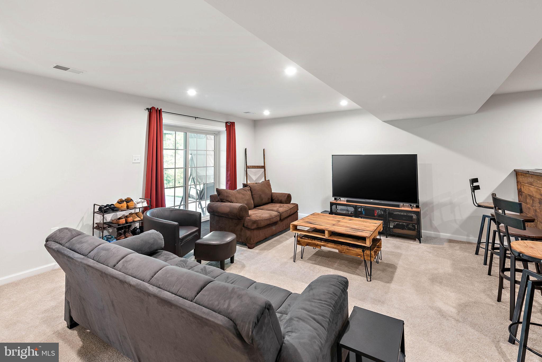 102 Pixie Moss Road Pottstown, PA 19464 - Photo 29 of 45 a living room with furniture and a flat screen tv