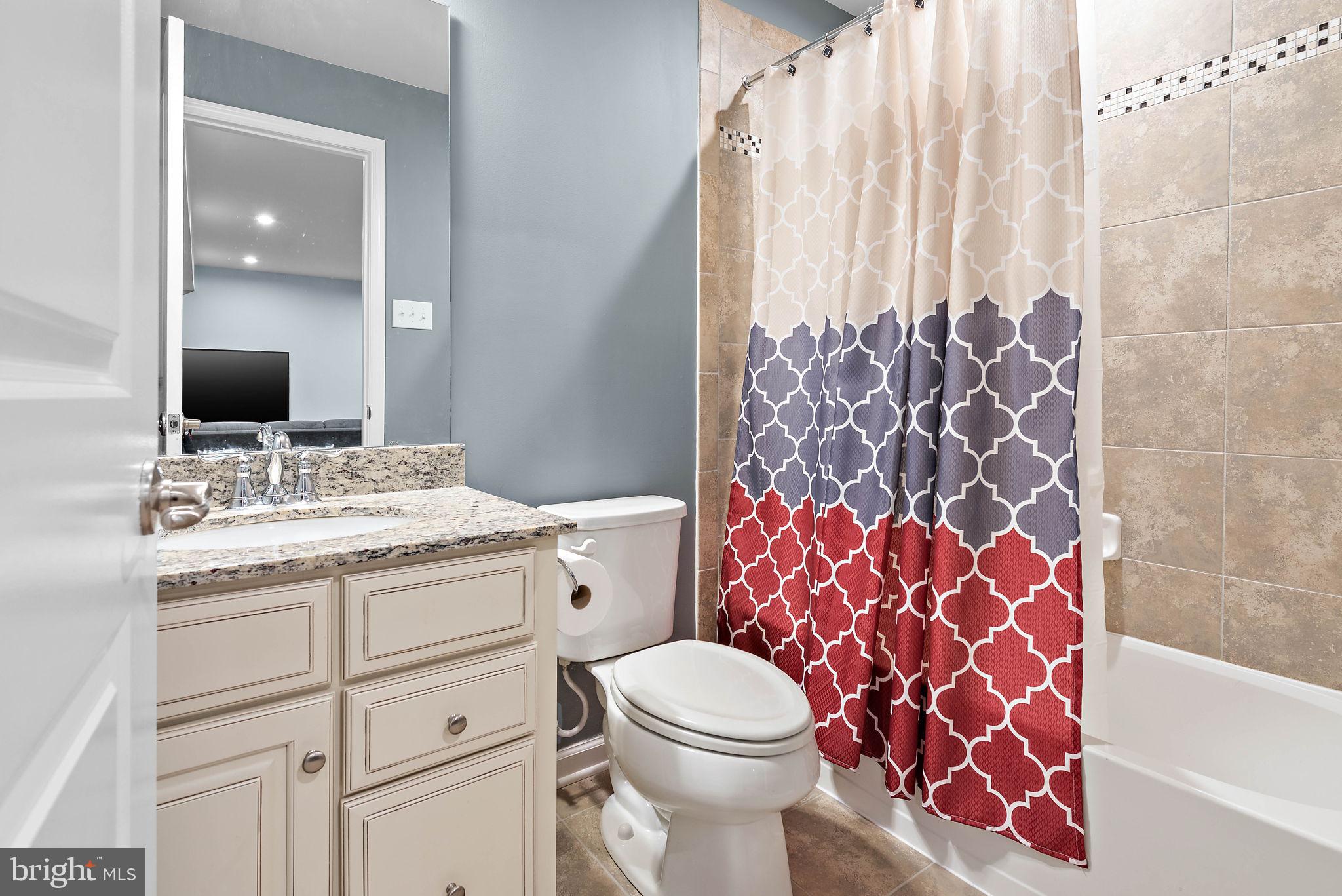 102 Pixie Moss Road Pottstown, PA 19464 - Photo 30 of 45 a bathroom with a granite countertop toilet sink and mirror