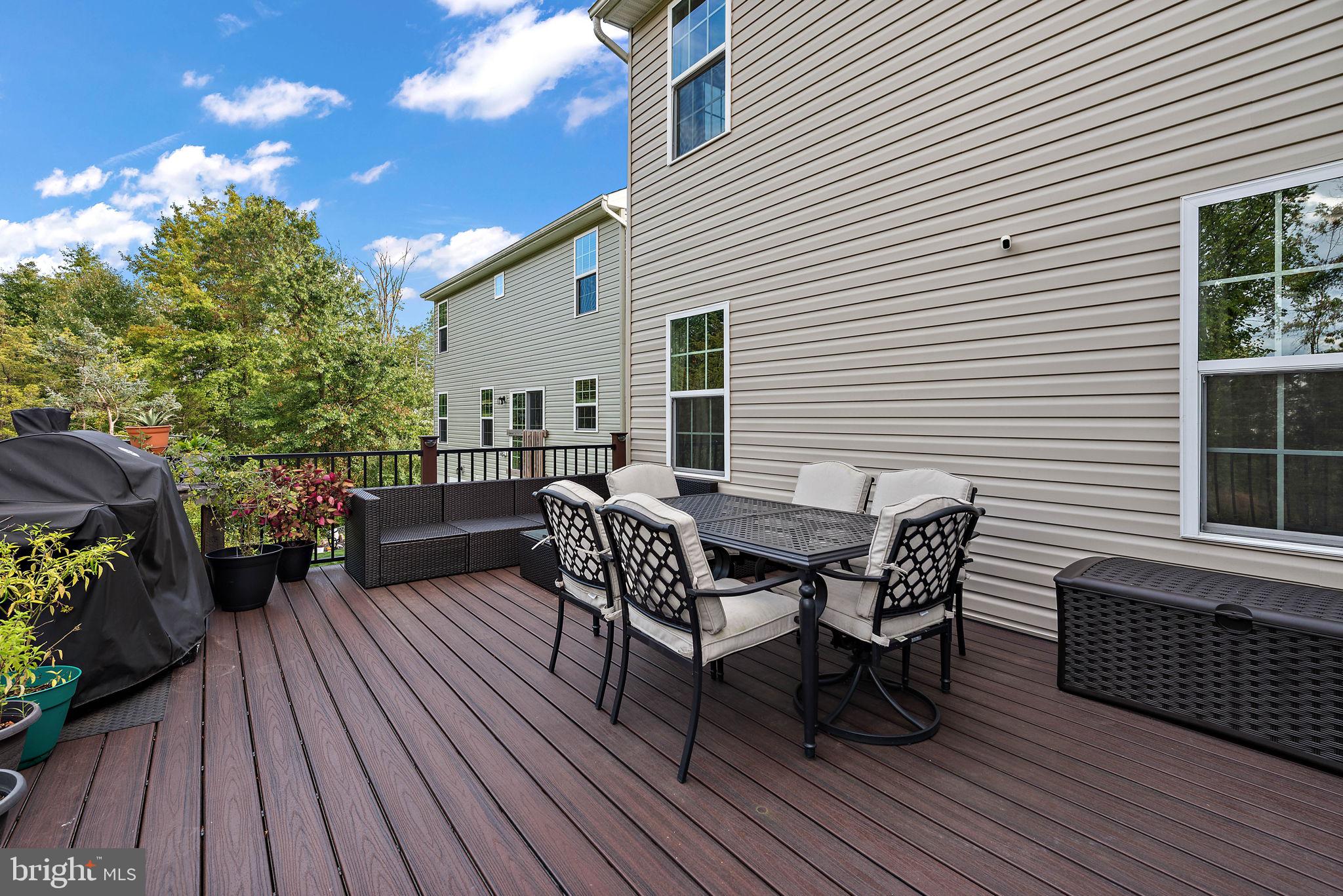 102 Pixie Moss Road Pottstown, PA 19464 - Photo 34 of 45 a view of a house with wooden deck and furniture