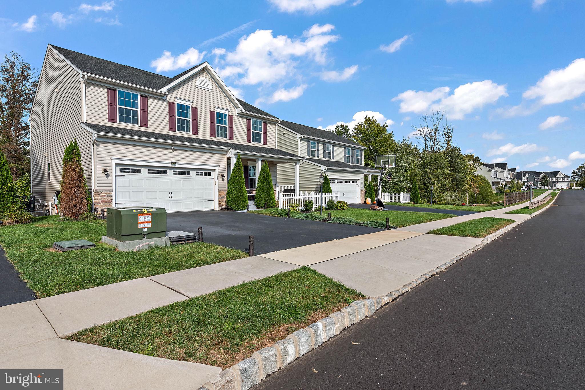 102 Pixie Moss Road Pottstown, PA 19464 - Photo 38 of 45 a view of a white house with a big yard and large trees