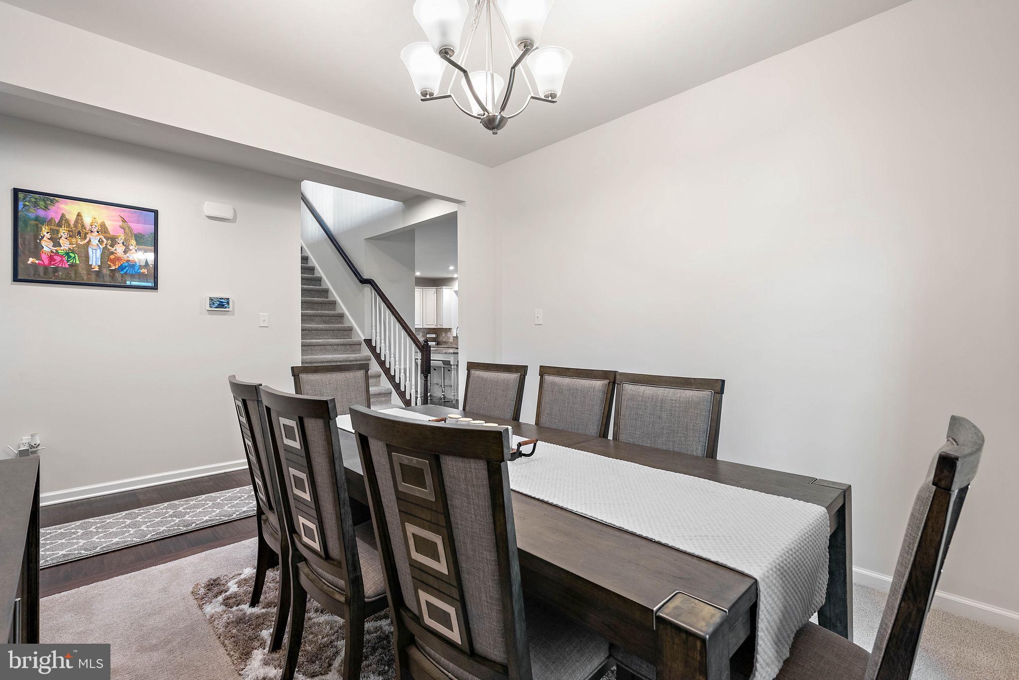 102 Pixie Moss Road Pottstown, PA 19464 - Photo 9 of 45 a view of a dining room with furniture and wooden floor