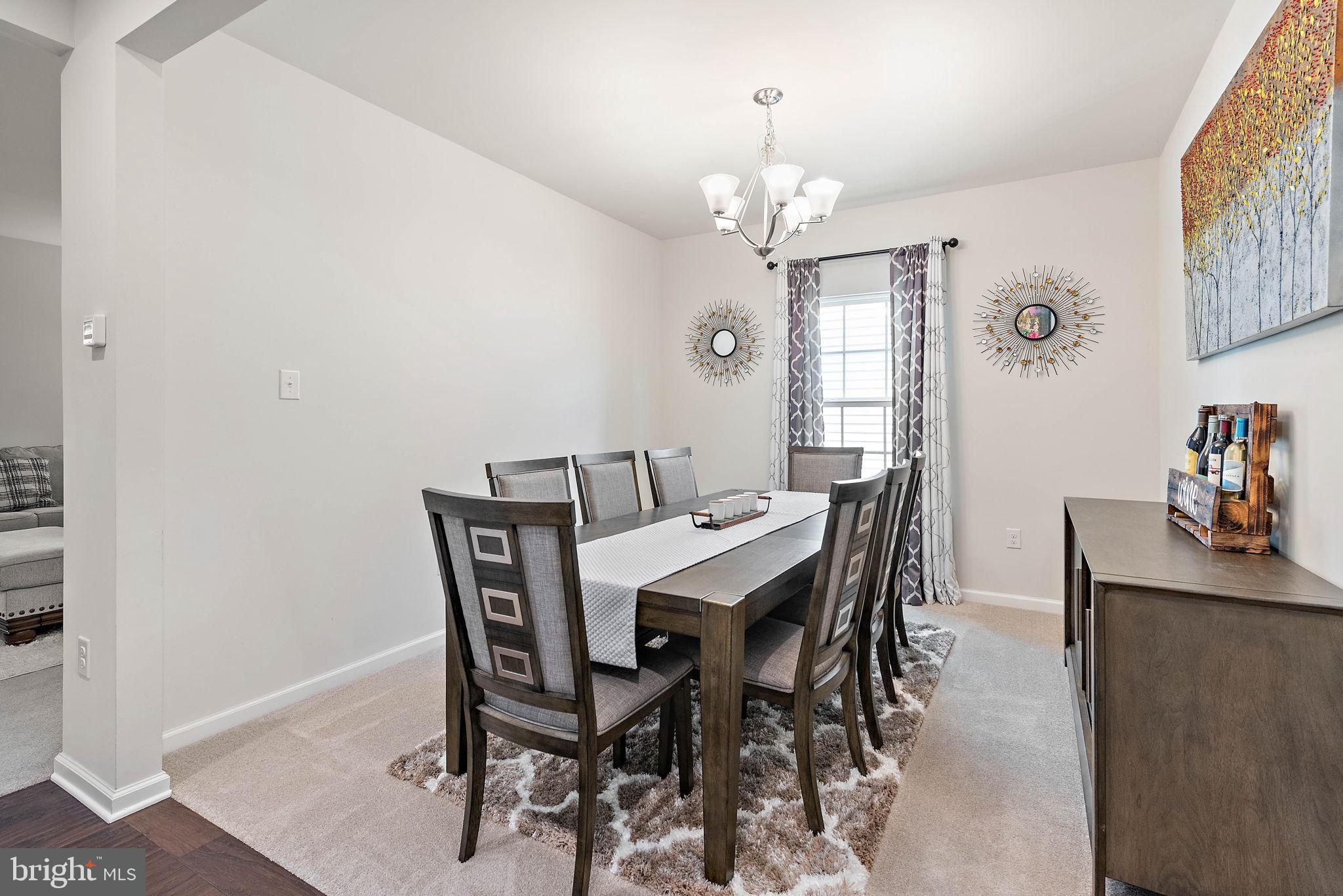 102 Pixie Moss Road Pottstown, PA 19464 - Photo 10 of 45 a view of a dining room with furniture and chandelier