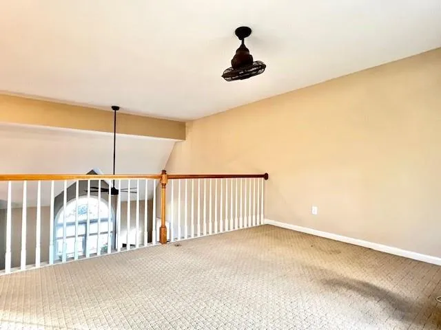 a view of entryway and hall with a window