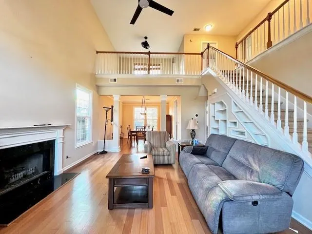 a living room with furniture and a fireplace