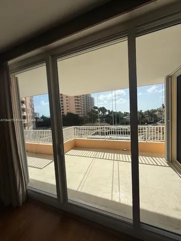 a view of entryway with wooden floor and stairs