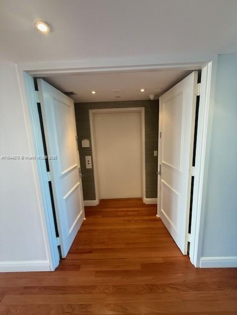 785 Crandon Boulevard, Unit 506 Key Biscayne, FL 33149 - Photo 16 of 58 a view of entryway with wooden floor and stairs