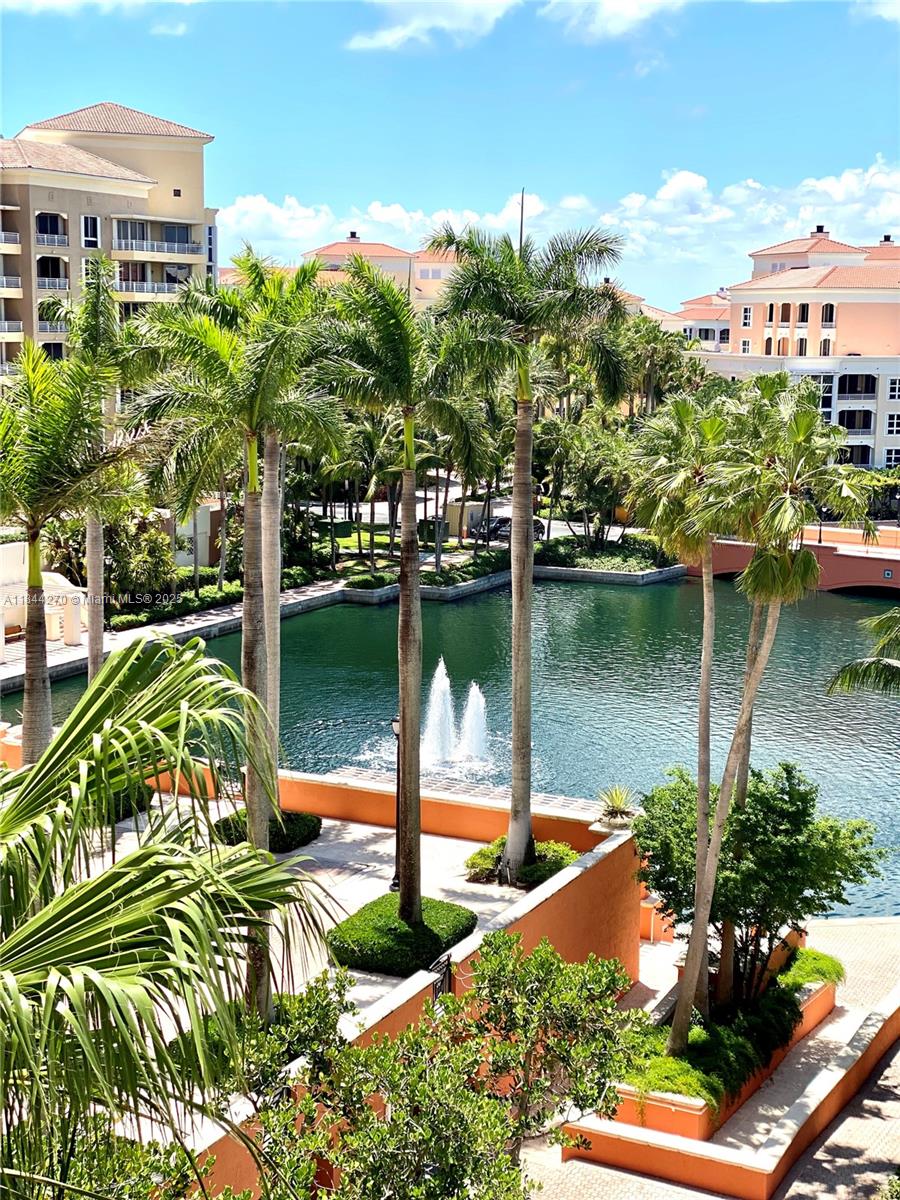 785 Crandon Boulevard, Unit 506 Key Biscayne, FL 33149 - Photo 2 of 58 a view of a lake with a house in the background