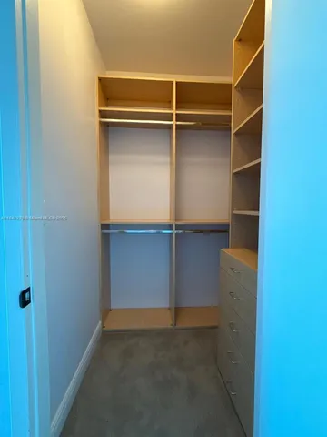 a bathroom with a bathtub shower sink and toilet