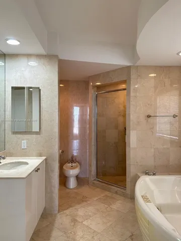 a view of a room with wooden floor and a sink