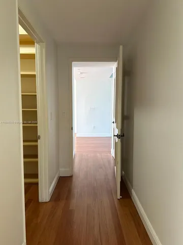 a bathroom with bathtub and window