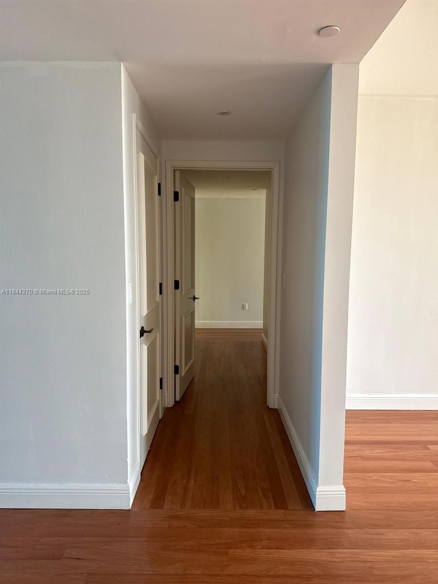 785 Crandon Boulevard, Unit 506 Key Biscayne, FL 33149 - Photo 42 of 58 a view of a hallway with wooden floor