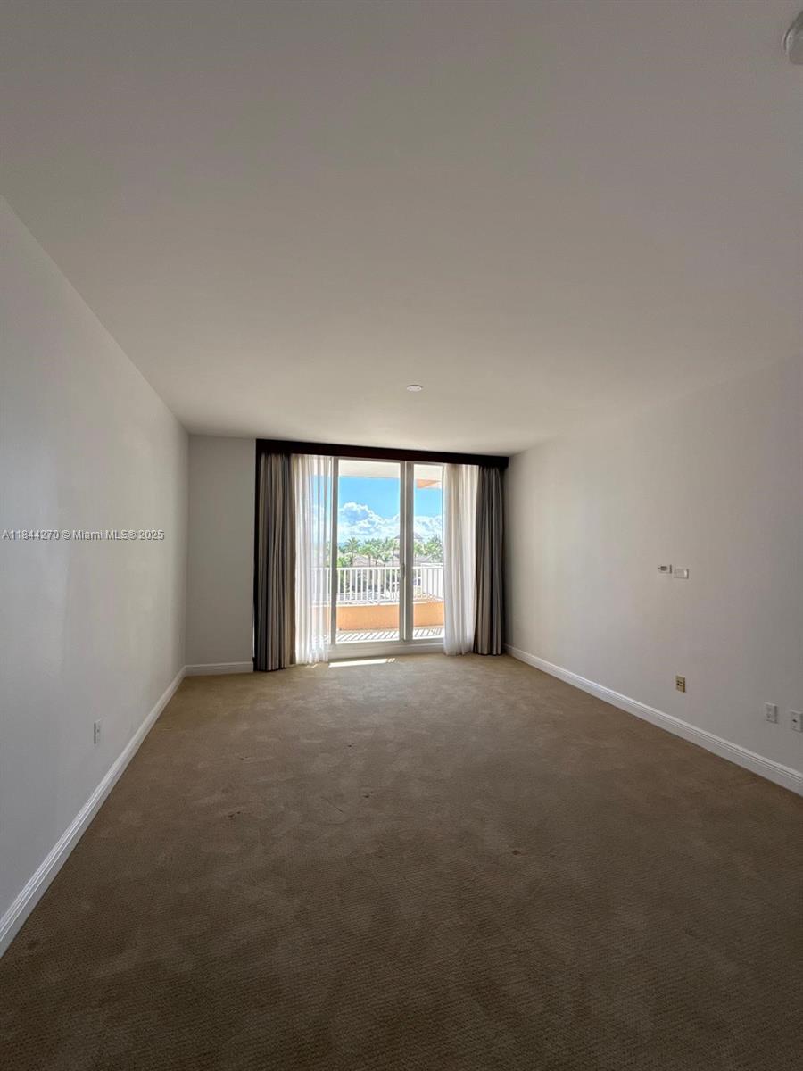 785 Crandon Boulevard, Unit 506 Key Biscayne, FL 33149 - Photo 43 of 58 a view of an empty room with a window