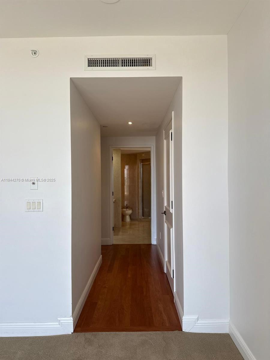 785 Crandon Boulevard, Unit 506 Key Biscayne, FL 33149 - Photo 44 of 58 a view of a hallway with wooden floor