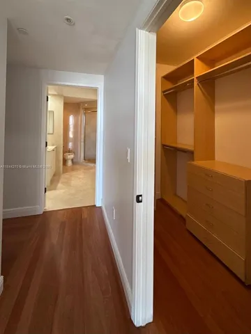 a bathroom with a shower sink and toilet