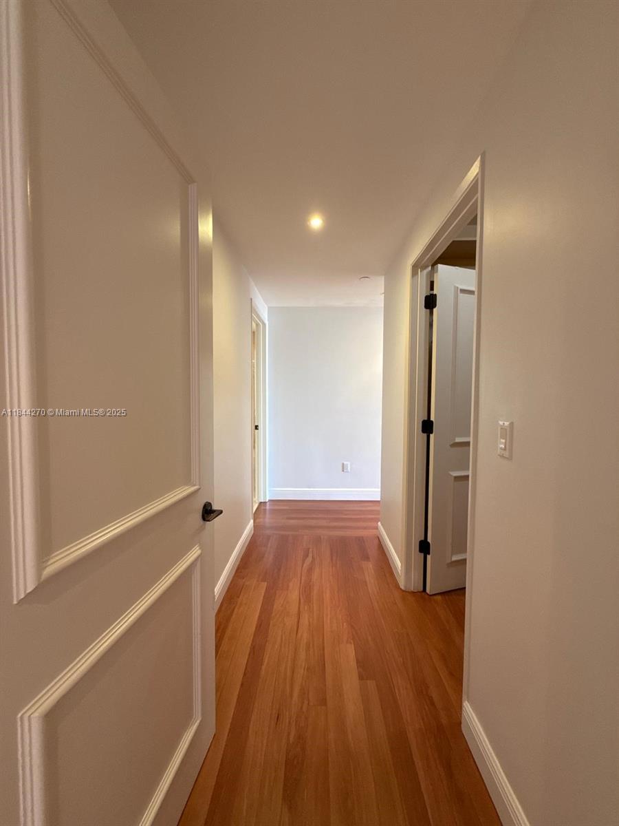 785 Crandon Boulevard, Unit 506 Key Biscayne, FL 33149 - Photo 46 of 58 a view of a room with wooden floor and a sink