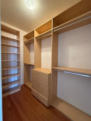 a view of a livingroom with furniture and a bathroom