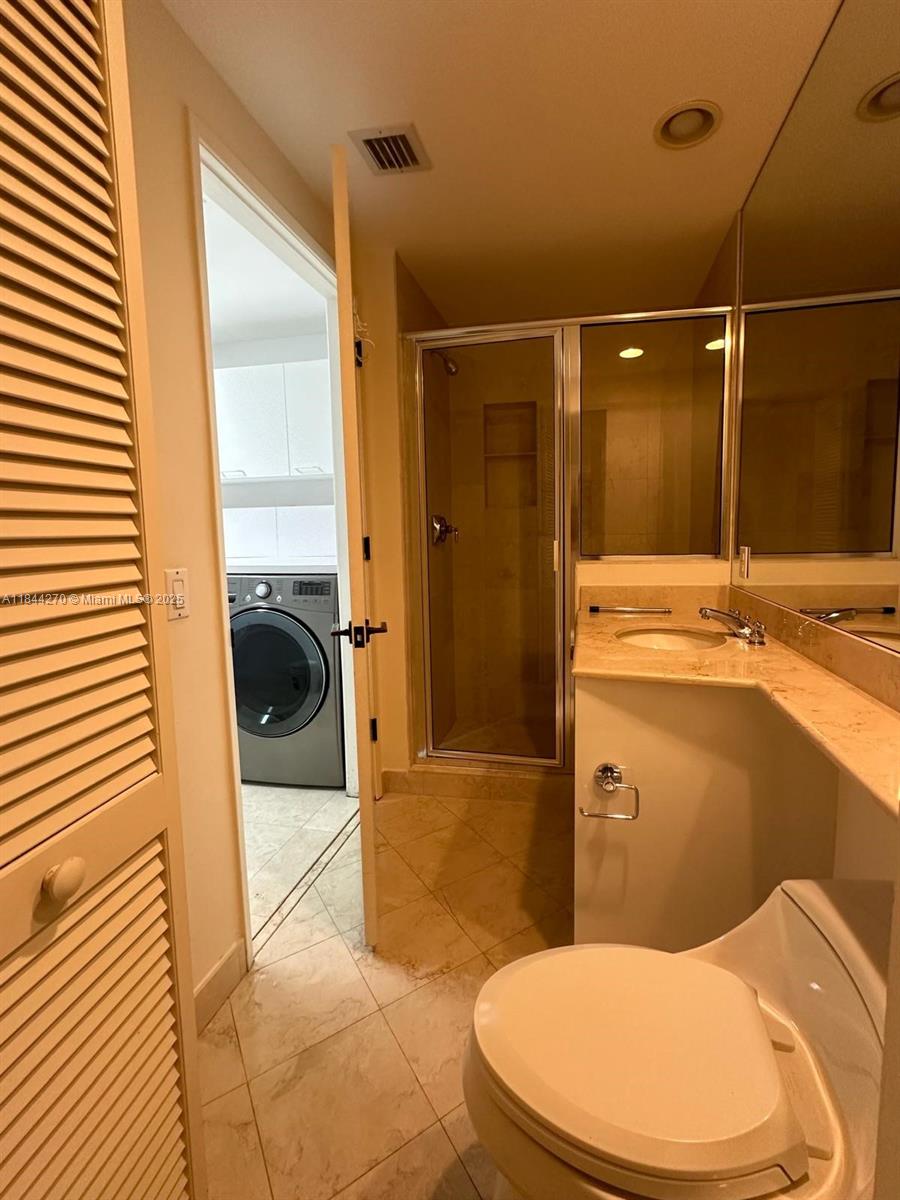785 Crandon Boulevard, Unit 506 Key Biscayne, FL 33149 - Photo 58 of 58 a bathroom with a sink toilet and shower
