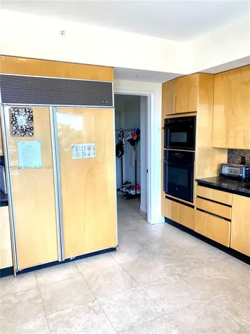a bathroom with a tub sink toilet and a mirror