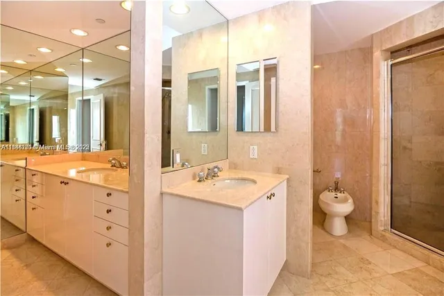 a view of a dining room with furniture a chandelier and wooden floor