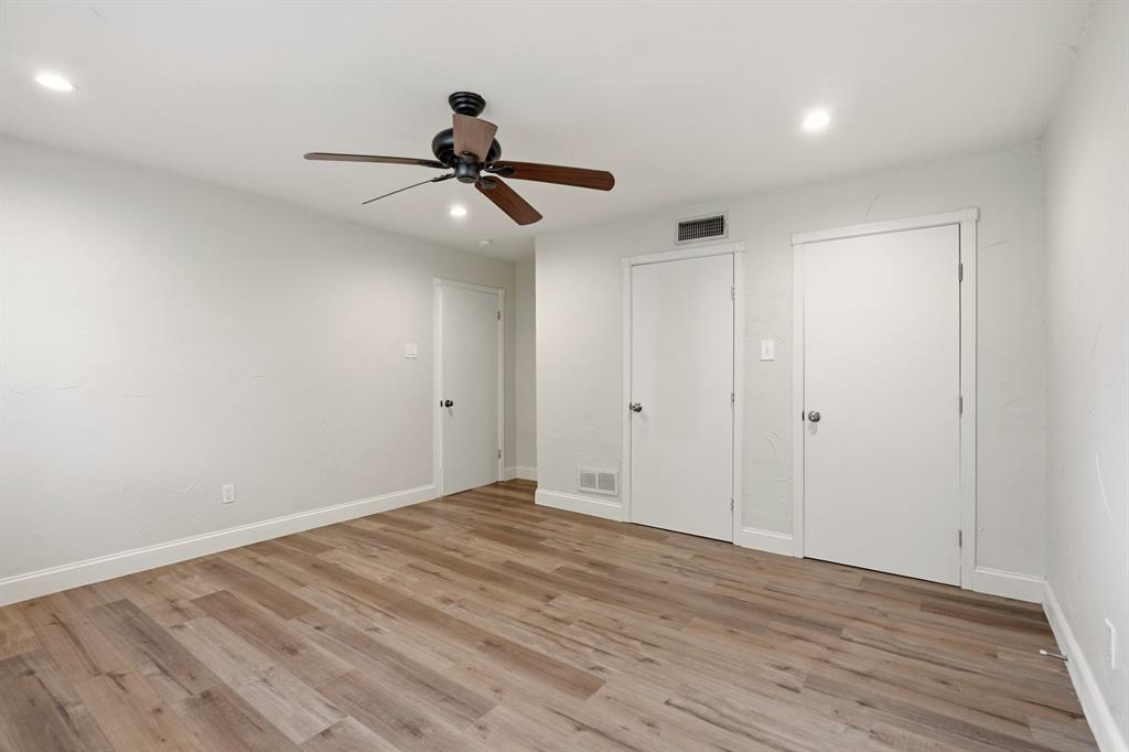 7354 Walling Lane Dallas, TX 75231 - Photo 23 of 28 a view of empty room with wooden floor