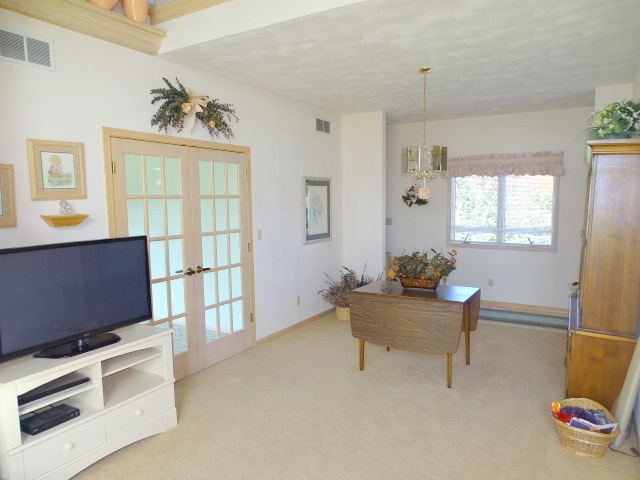 3189 West Forest Road Freeport, IL 61032 - Photo 6 of 22 a work room with furniture and windows