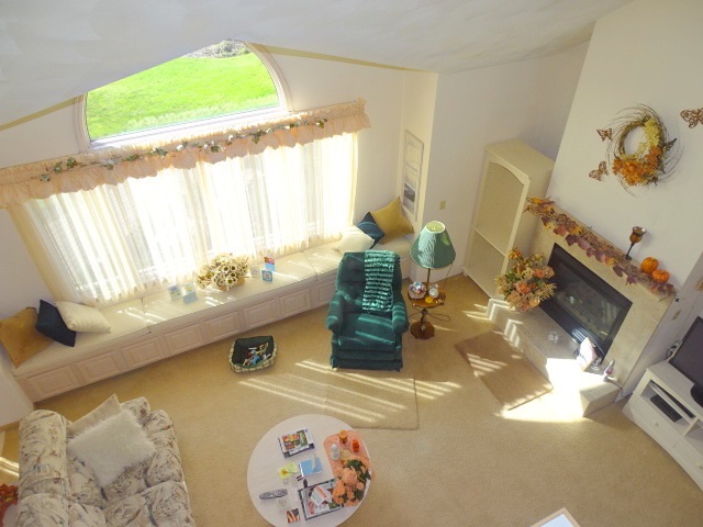 3189 West Forest Road Freeport, IL 61032 - Photo 8 of 22 a dining table with a fireplace and a large window
