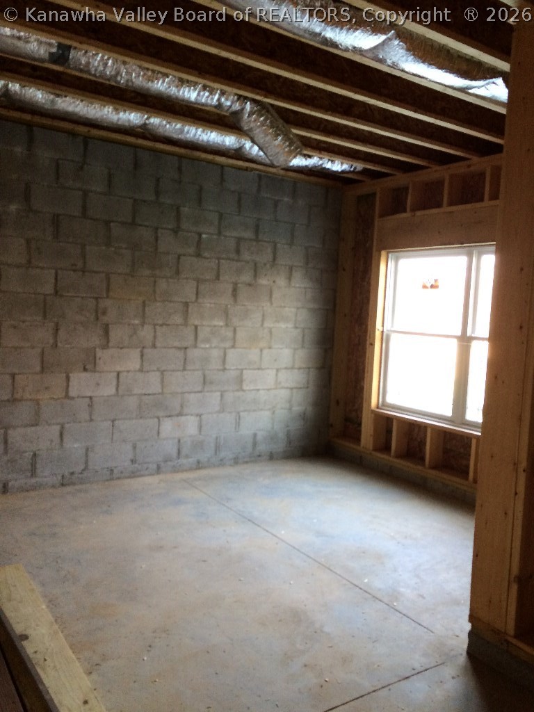 199 Hedrick Road, Unit 180 Scott Depot, WV 25560 - Photo 29 of 30 This is an unfinished basement, great for storage, but perfect for future expansion space. The large Anderson windows contribute a light airy future finished space with rough in for a full bath. Future plans could include rec room, 4th bedroom and full bath.