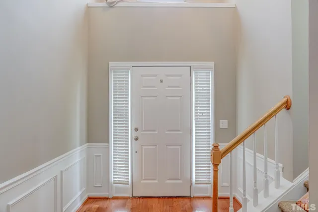 a view of front door with wooden floor