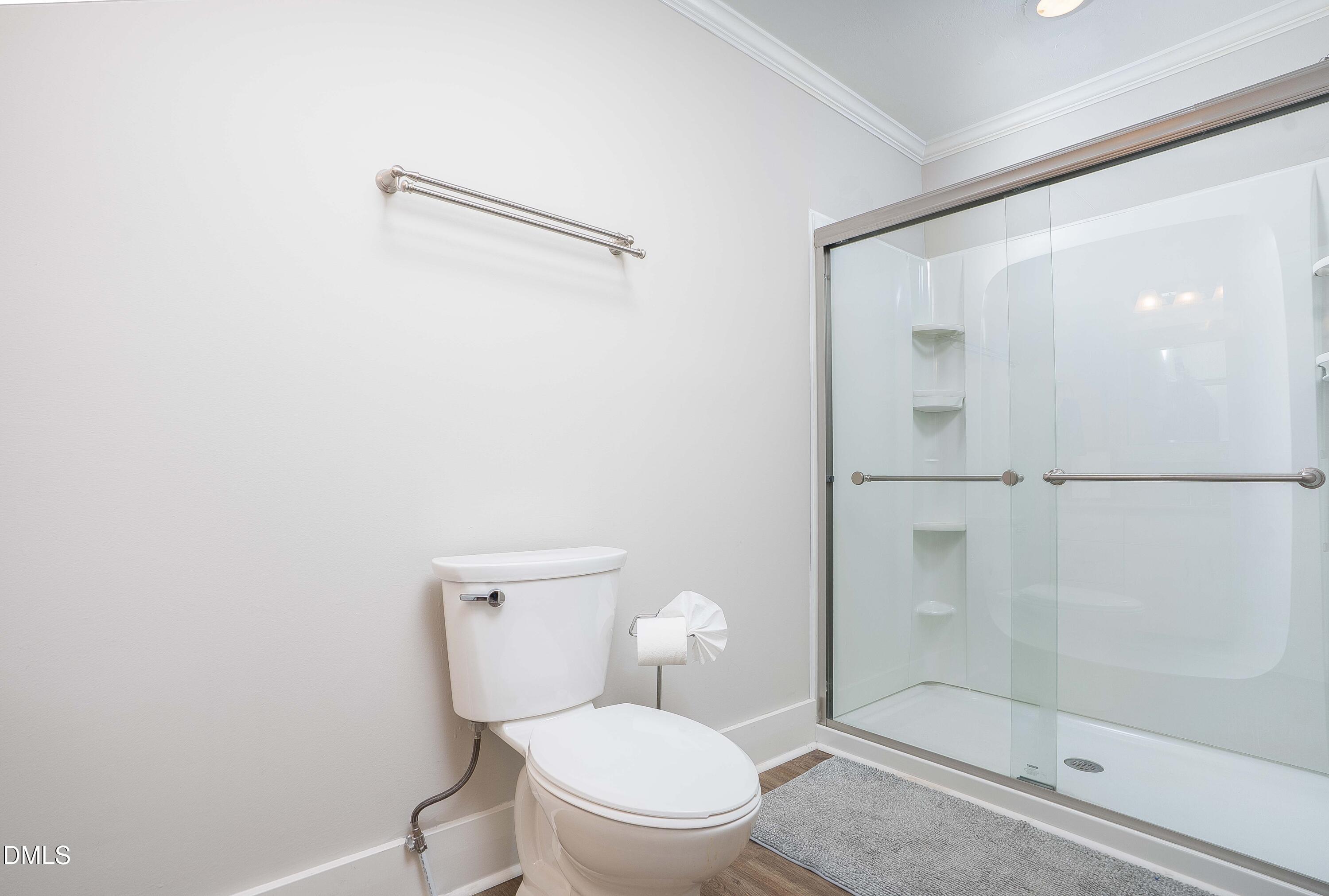 1405 Quarter Point Raleigh, NC 27615 - Photo 15 of 19 a white toilet sitting next to a bathroom sink