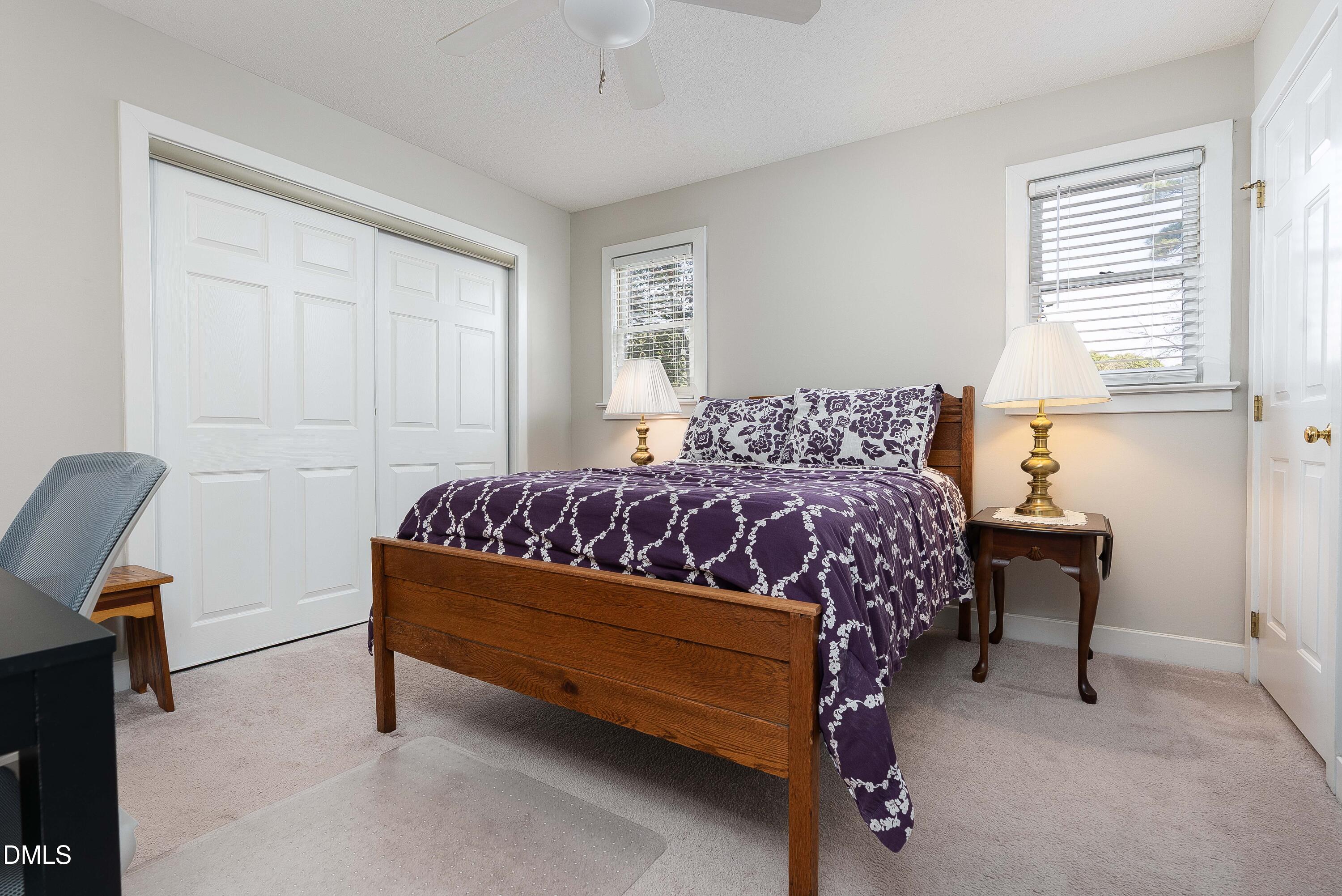 1405 Quarter Point Raleigh, NC 27615 - Photo 16 of 19 a bedroom with a bed chair and a window