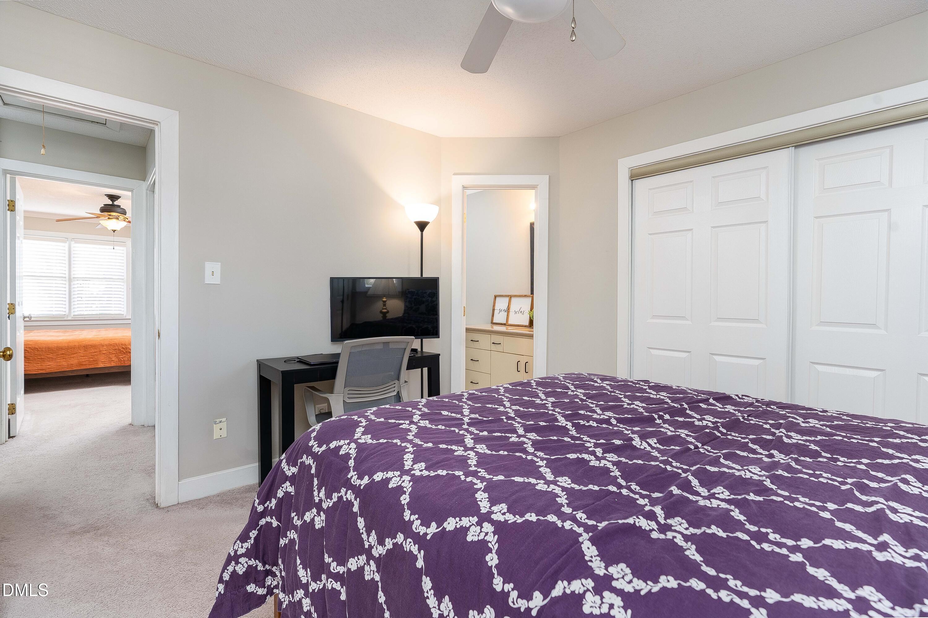 1405 Quarter Point Raleigh, NC 27615 - Photo 17 of 19 a bedroom with a bed and a television