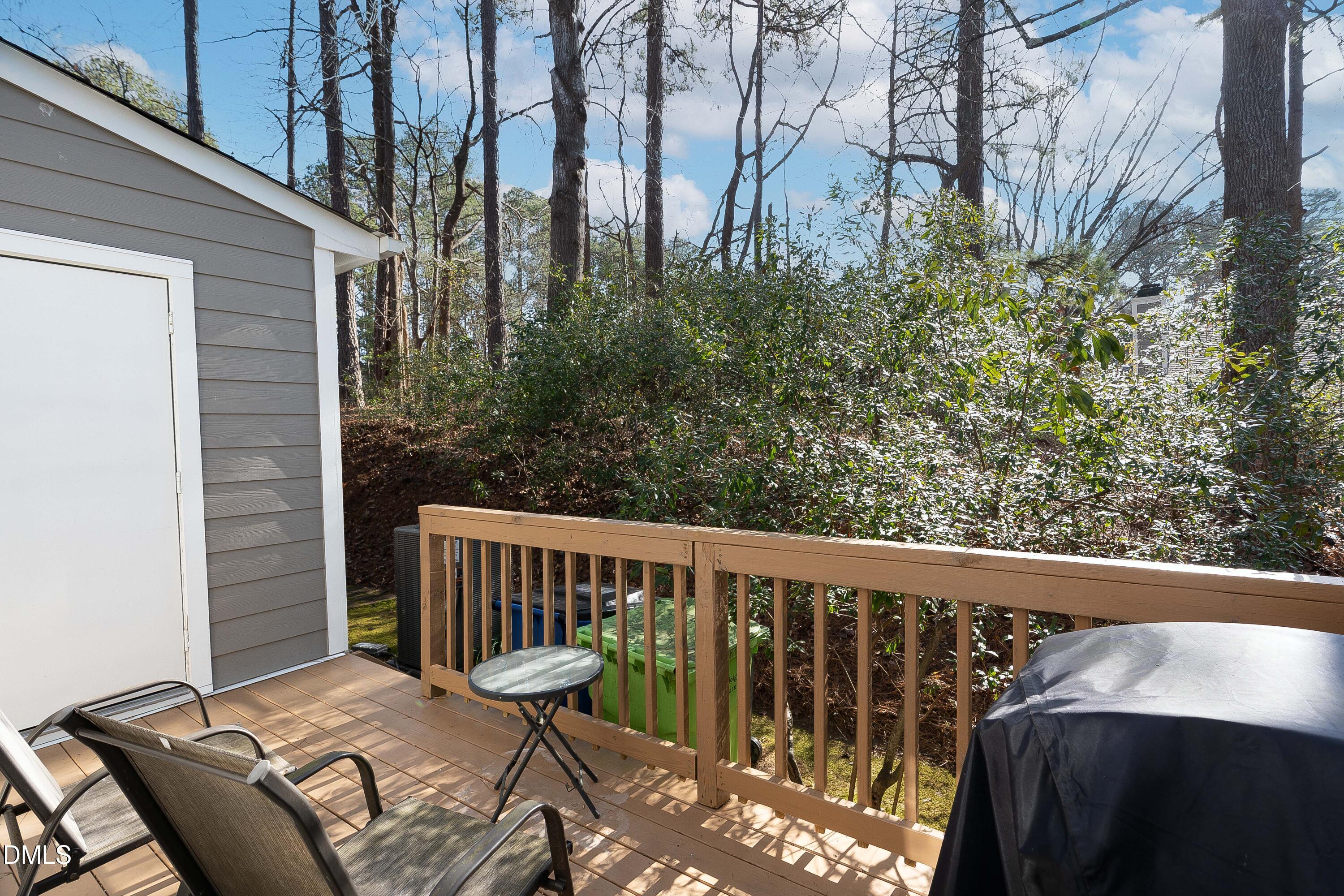 1405 Quarter Point Raleigh, NC 27615 - Photo 19 of 19 a view of balcony with wooden floor and outdoor seating