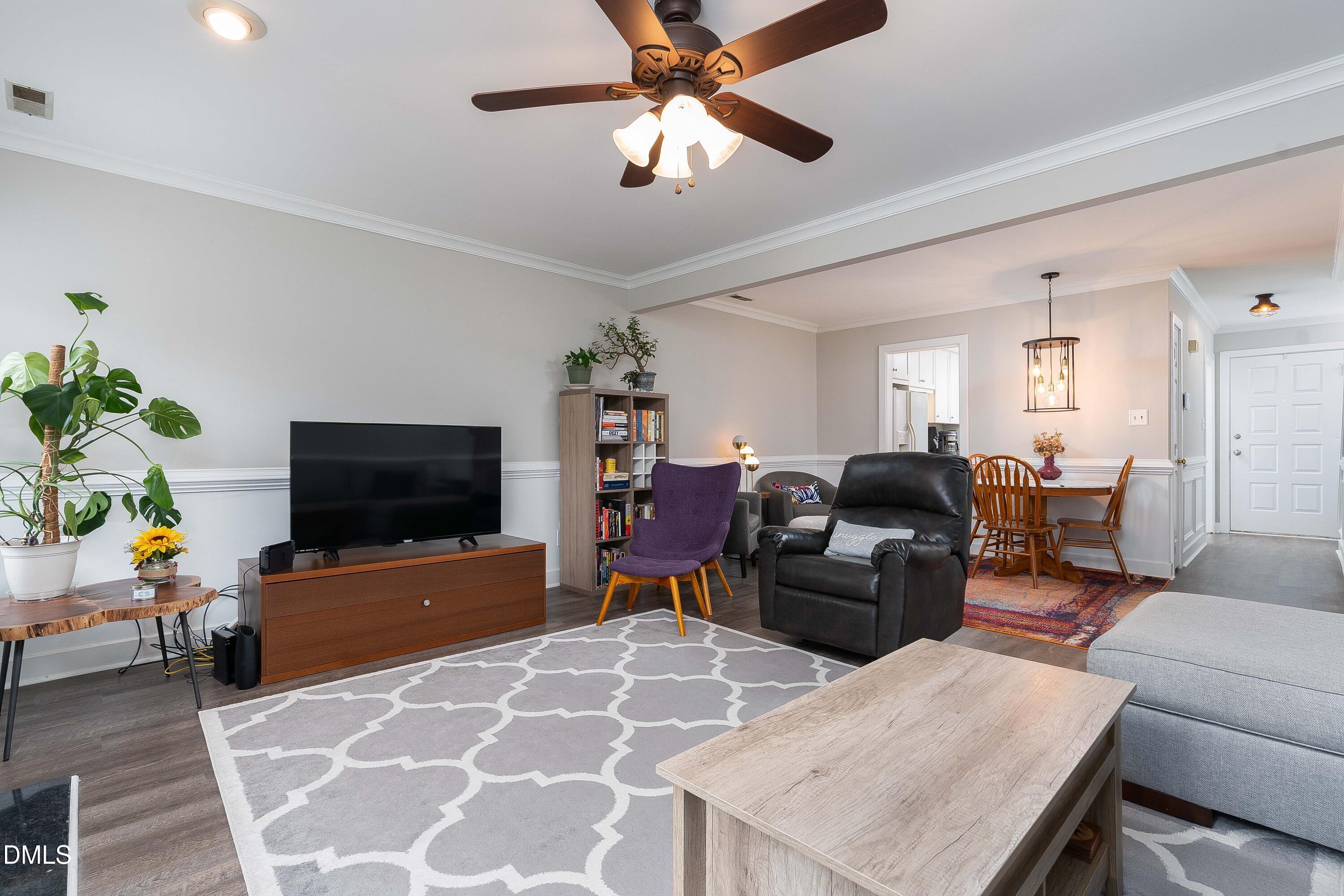 1405 Quarter Point Raleigh, NC 27615 - Photo 9 of 19 a living room with furniture and a flat screen tv